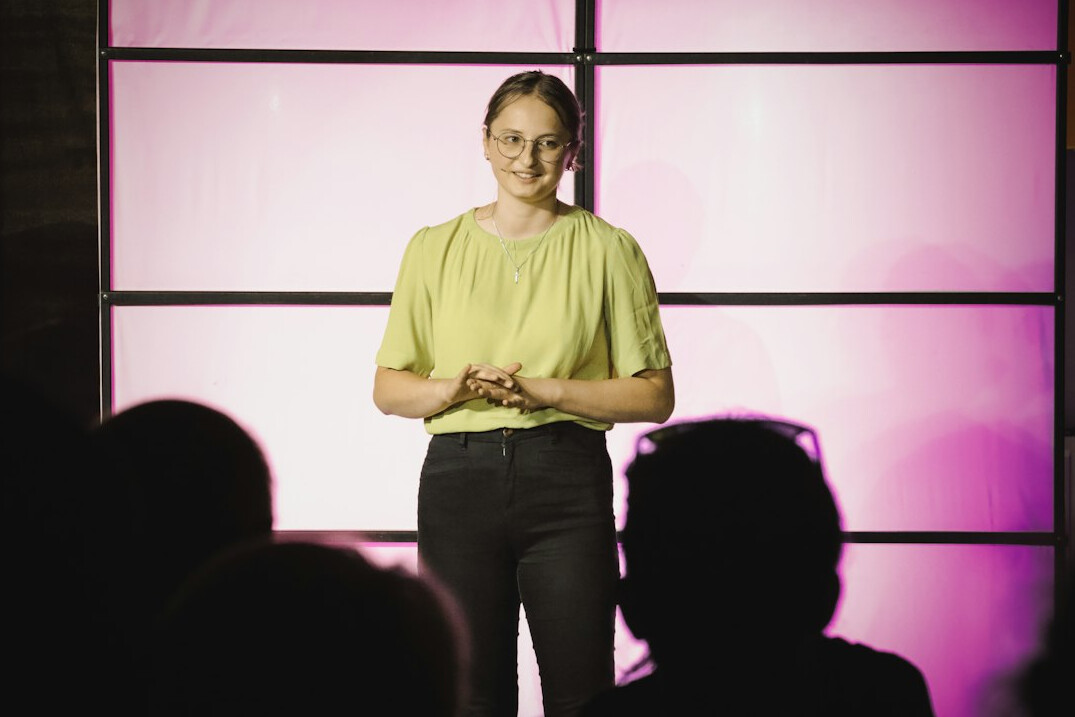 confident woman speaking to group