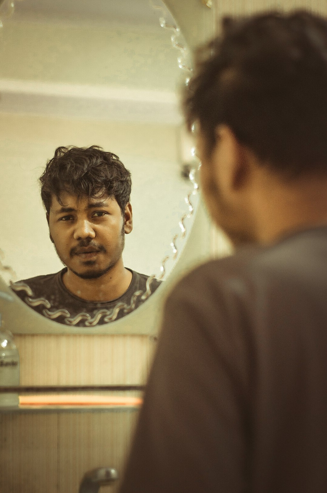 man practicing speech in mirror